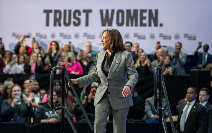 Kamala Harris speaking at a conference, representing the fight for gender equality and political representation for women