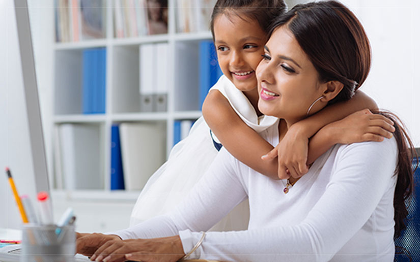 A mompreneur at her workspace with her daughter, showcasing the balance of motherhood and entrepreneurship